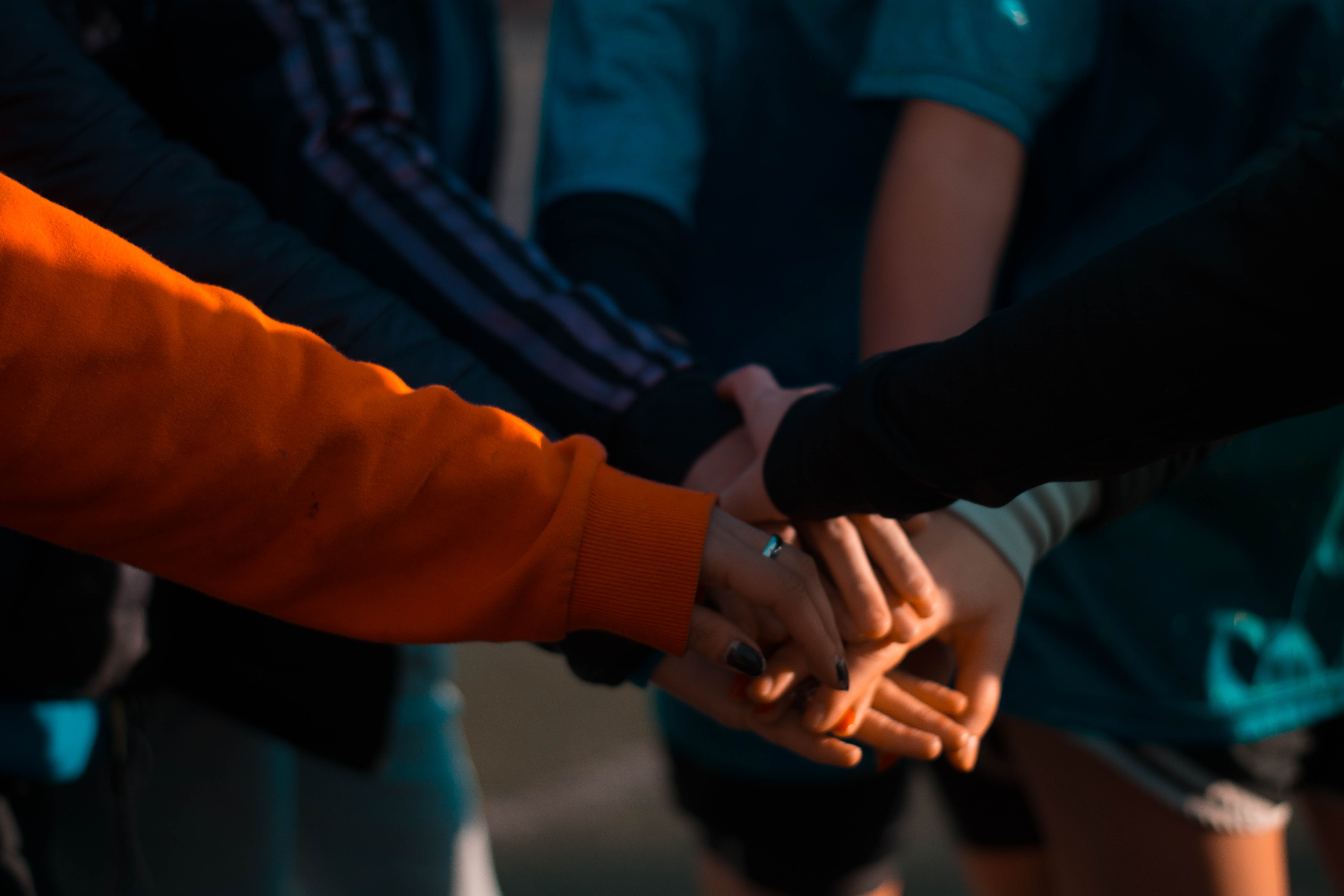 group-of-people-huddling-up-1198171